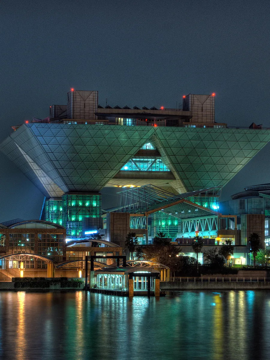 Tokyo Big Sight lit up at night across the water